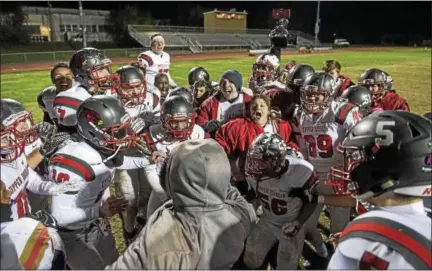  ?? RICK KAUFFMAN — DIGITAL FIRST MEDIA U ?? Upper Dublin teammates celebrate following the 17-12 victory over Academy Park Friday night.