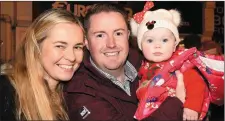  ??  ?? Mary, Martin and Tara Mulreidy, Beaufort, enjoying the Christmas in Killarney Parade in Killarney on Saturday.