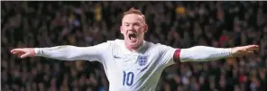  ?? AFP ?? Wayne Rooney celebrates scoring England’s third goal, his second of the night, in a 3-1 friendly victory over Scotland at Celtic Park, Glasgow in November 2014.