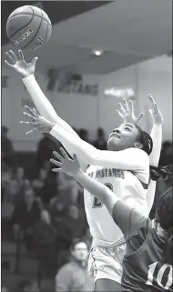  ?? Photo by Loni Mendez ?? Aunisti Griffin shoots over a Lake View defender in the Lady Mustangs’ win Friday.