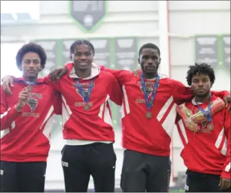  ?? COURTESY OF TRENTON CENTRAL TRACK & FIELD ?? Trenton’s Deshawn Allen, Vangamun Sheriff, Rabiah Free and Gabriel Truehart pose after taking fourth place in the 4x400relay at Sunday’s Meet of Champions on Staten Island.