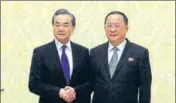  ?? AP ?? ■ Chinese foreign minister Wang Yi (left) with his North Korean counterpar­t Ri Yong Ho in Pyongyang on Wednesday.