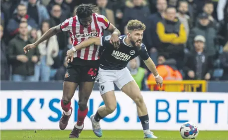  ?? ?? Sunderland’s Aji Alese with Millwall’s Tom Bradshaw battle for the ball.