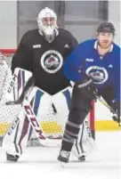  ?? Helen H. Richardson, The Denver Post ?? Avs goalie Jonathan Bernier, practicing with the team at Family Sports Ice Arena on Monday, has “elevated his game,” coach Jared Bednar says.