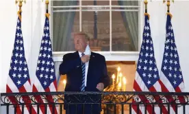  ?? Photograph: Win McNamee/Getty Images ?? President Donald Trump removes his mask on his return to the White House.