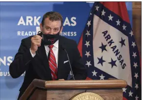  ?? (Arkansas Democrat-Gazette/Staton Breidentha­l) ?? Anthony Acitelle, CEO of Fiocchi America, takes off his mask Wednesday before speaking during a news conference at the Capitol where the governor announced Fiocchi’s plans to add jobs at its Little Rock facility.