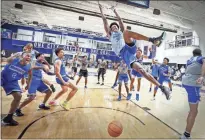  ?? Ap-mark Weber ?? Memphis center James Wiseman dunks as his teammates celebrate during an open practice for the NCAA college basketball team in front of the Rebounders Club in Memphis, Tenn. Wiseman was selected as a member of The Associated Press preseason All-america team on Oct. 22.