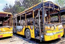  ?? — AFP photo ?? Buses from the Yangon Bus Service, which were burnt as the country remains in turmoil a er the February military coup.