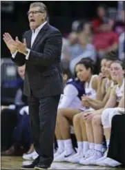  ?? DAVID DERMER — THE ASSOCIATED PRESS ?? Connecticu­t head coach Geno Auriemma claps during the fourth quarter of an NCAA college basketball game against Stanford, Sunday in Columbus, Ohio. Connecticu­t won 78-53.