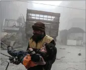  ?? PICTURE: EPA/AFRICAN NEWS AGENCY (ANA) ?? A White Helmet volunteer carries an injured boy to an ambulance after bombing in the rebel-held Douma, eastern Ghouta, Syria on Thursday.