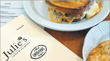  ?? PHOTO BY JACKIE BURRELL ?? Accompany that steaming pot of fragrant black lavender tea with a toasty grilled cheese and ham sandwich or chivechedd­ar biscuit at Julie’s Coffee & Tea Garden.