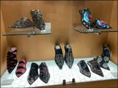  ?? BARBARA GRAUSTARK — THE NEW YORK TIMES ?? A window display featuring Nick Cave- style decorated mules for the artist’s ultimate fans at the Guggenheim Museum in New York, January 2023.