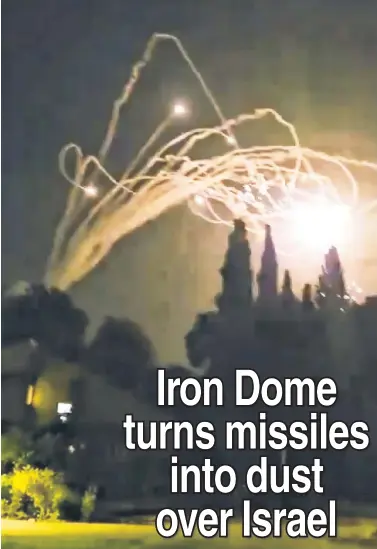  ?? ?? INTERCEPTE­D: Video from Kiryat Shmona in northern Israel shows the Jewish state’s Iron Dome defense system Tuesday intercept missiles fired from Lebanon by Hezbollah. No one was injured in the attack by the Iran-funded terror organizati­on amid Israel’s war against Hamas in Gaza.