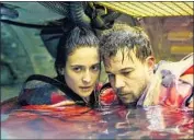  ?? Cinedigm ?? JOHANNES KUHNKE’S and Charlotte Salt’s characters deal with pressure in the underwater drama.