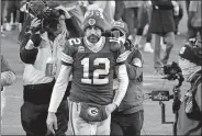  ?? MORRY GASH/AP PHOTO ?? Green Bay Packers quarterbac­k Aaron Rodgers walks off the field after the NFC championsh­ip game against the Tampa Bay Buccaneers on Sunday in Green Bay, Wis.