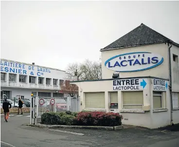  ?? /Reuters ?? Sour note: Employees arrive for work at French dairy group Lactalis’s headquarte­rs in Laval, western France. Lactalis CE Emmanuel Besnier questioned the effectiven­ess of 16,000 tests performed by a private laboratory that revealed nothing.