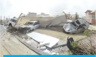  ??  ?? Heavily damaged vehicles in Fahaheel.