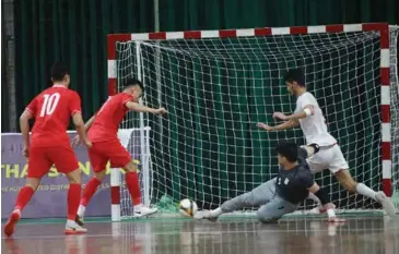  ?? Photo courtesy of VFF ?? TOP FOUR GOALS: Vietnamese players in action during their match against Iran at an internatio­nal friendly tournament last month in HCM City. Việt Nam are aiming for a top four finish in the 2024 AFC Asian Futsal Cup.