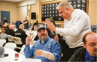  ?? Marie D. De Jesús / Staff photograph­er ?? Capt. Wesley Hensley, left, and Deputy Sgt. James Smejkal were wounded during a standoff in December in which the gunman also died. A lunch and auction Friday benefited the two.