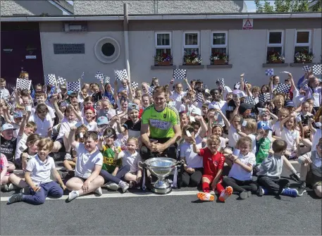  ??  ?? Keith Raymond, Sligo hurling captain visits St John’s NS in Ballisodar­e with the Lory Meagher cup. Pics: Donal Hackett.