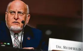  ?? Alex Edelman / AFP / Tribune News Service ?? Centers for Disease Control and Prevention Director Robert Redfield testifies during a Senate committee hearing on COVID-19 last month inWashingt­on.