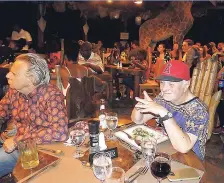  ??  ?? Guests have dinner on the Safari Deck at Great Huts.