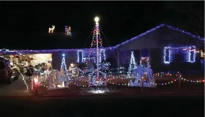  ?? SUBMITTED ?? Seth Brown, 15, of Searcy decorated his home at 1301 Wallis Drive. and programmed the lights to flash with music that is broadcast on 95.5 FM.