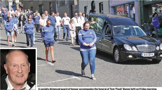  ??  ?? A socially distanced guard of honour accompanie­s the funeral of Tom ‘Flash’ Dunne (left) on Friday morning.