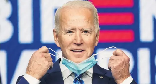  ?? PHOTO: REUTERS ?? On track . . . United States presidenti­al nominee Joe Biden smiles as he pulls off his face mask to speak in Wilmington, Delaware, yesterday about the results of the 2020 election.