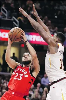  ?? TONY DEJAK/THE ASSOCIATED PRESS ?? The Raptors’ Fred VanVleet shoots against the Cavs’ Tristan Thompson on Saturday in Cleveland.