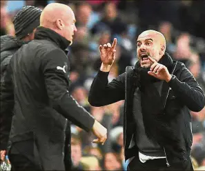  ??  ?? What’s your problem?: Manchester City manager Pep Guardiola (right) arguing with his Burnley counterpar­t Sean Dyche during the English FA Cup third round match at the Etihad on Saturday. City won 4-1. — AFP