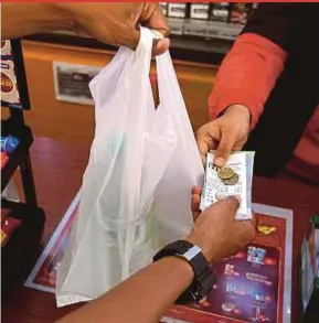  ?? FILE PIC ?? A more workable policy on plastic bags is to incentivis­e the public by giving them 20 sen if they brought recyclable bags.