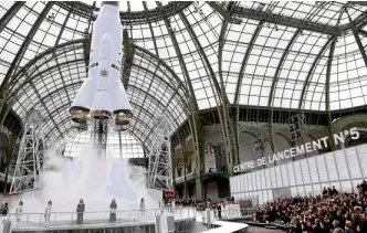  ?? —AFP ?? Chanel under Lagerfeld put the “show” in “fashion show.” For Fall-Winter 2017-18 women’s ready-to-wear collection, the fashion house launched a “rocket ship” at Paris’ Grand Palais.