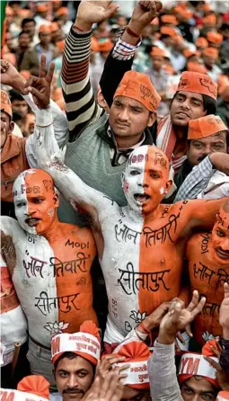  ??  ?? MANEESH AGNIHOTRI BJP SUPPORTERS AT MODI'S VIJAY SHANKHNAD RALLY IN LUCKNOW