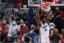  ?? JOHN BAZEMORE — THE ASSOCIATED PRESS ?? Sixers center Joel Embiid dunks during the second half of Game 3 against the Hawks, Friday, in Atlanta.