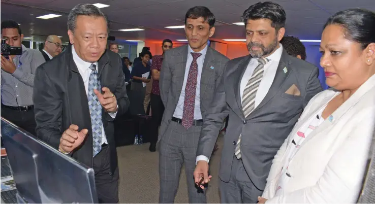  ?? Ronald Kumar ?? Consultant Koi Voon Soon, (left) explains the bizFIJI Online Portal to Ministry of Industry, Trade and Tourism Permanent Secretary Shaheen Ali, Attorney-General and Minister for Economy Aiyaz Sayed- Khaiyum and Minister for Industry, Trade and Tourism Premila Kumar following the launch of the bizFIJI Online Portal in Suva on July 10, 2019. Photo: