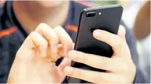  ?? AP FILE PHOTO ?? A new analysis suggests that increased social media use could be one factor contributi­ng to a rise in teen suicide.