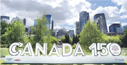  ?? RYAN McLEOD ?? Canada’s 150th, celebrated in this Calgary sign, is also getting attention from Fairmont Hotels.