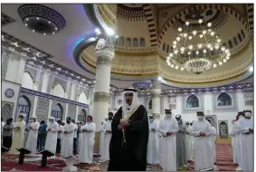  ?? (AP/Kamran Jebreili) ?? The Absentee Prayer is performed Friday in Dubai, United Arab Emirates, after the death of Emirati President Sheikh Khalifa bin Zayed Al Nahyan. More photos at arkansason­line.com/514khalifa/.