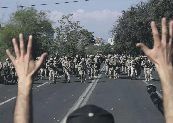  ?? AP ?? About 9,500 security personnel fired tear gas and water cannon at Chilean protesters at the weekend