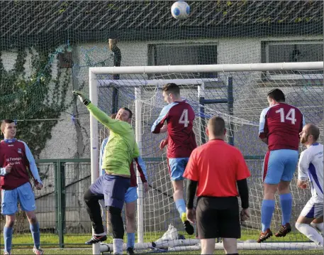  ??  ?? Mark O’Hora, Dromore Villa goalkeeper, makes a save against Carrick Town. Below: Kevin McGee, Dromore Villa in action. Pics: Carl Brennan.