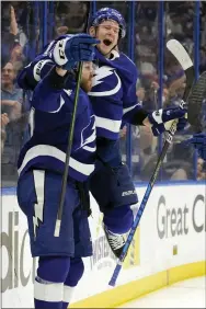  ?? CHRIS O’MEARA — THE ASSOCIATED PRESS ?? Tampa Bay Lightning defenseman Erik Cernak, left, celebrates his goal with left wing Ondrej Palat during the second period of a Game 3 win over the Florida Panthers Sunday.
