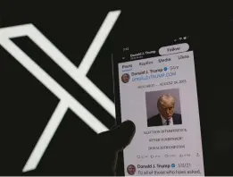  ?? CHRIS DELMAS/GETTY-AFP ?? Former President Donald Trump’s mug shot is shown Thursday on X, marking his return to the platform formerly known as Twitter. He was banned in early 2021.