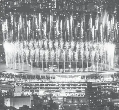  ?? CHARLY TRIBALLEAU/GETTY-AFP ?? Fireworks light up the sky over the Olympic Stadium during the closing ceremony of the Tokyo Games on Sunday.