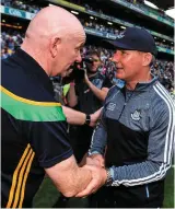  ?? DAVID FITZGERALD/SPORTSFILE ?? Donegal’s Hugh McFadden wins the aerial battle with Dublin’s Jonny Cooper. Above: Niall Scully celebrates after scoring Dublin’s first goal; Dubs boss Jim Gavin shakes hands with Donegal manager Declan Bonner