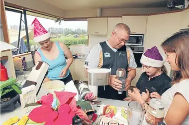  ?? Photos: DEAN KOZANIC/FAIRFAX NZ ?? Precious time: Sharemilke­r Chris Ford offered to workNewYea­r’s Day so he could spend Christmas Day with his wife Jodi and daughters Leah and Tayla.