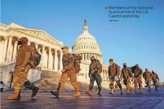  ?? Reuters ?? Members of the National Guard arrive at the US Capitol yesterday.