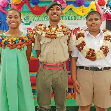  ?? Photo: Nicolette Chambers ?? From left: Drasa Avenue Primary School head girl, Vani Moreyawa, Republic of the Fiji Military Forces Second Lieutenant, Pio Loaloa, and head boy, Krish Lal after the school’s prefect induction ceremony on February 6, 2020.