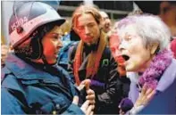  ??  ?? Lower East Side community organizer Frances Goldin gets in faceoff with cop at Occupy Wall Street protest in 2011.