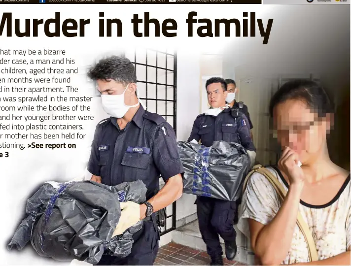  ??  ?? Horrific find: Policemen taking away what is believed to be the plastic containers in which the bodies of the two children were found. The children’s mother has been held by police to assist in the investigat­ions.